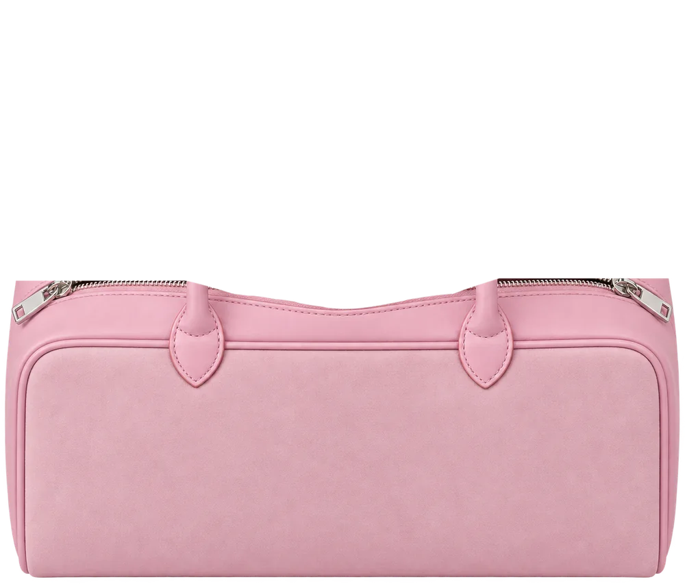An open handbag with a free pad dropped inside